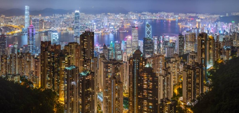 Hong Kong harbour and skyline, seen from Victoria Peak on a rainy night of June 2019.