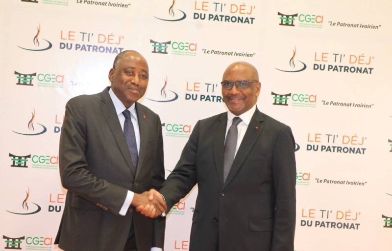 L’ex-premier ministre Amadou Gon Coulibaly et le Président de la CGECI, Jean-Marie ACKAH