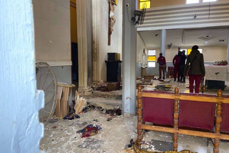 St Francis Catholic Church following an explosion in Owo Nigeria, Sunday, June 5, 2022. Lawmakers in southwestern Nigeria say more than 50 people are feared dead after gunmen opened fire and detonated explosives at a church. Ogunmolasuyi Oluwole with the Ondo State House of Assembly said the gunmen targeted the St Francis Catholic Church in Ondo state on Sunday morning just as the worshippers gathered for the weekly Mass. (AP Photo/Rahaman A Yusuf)