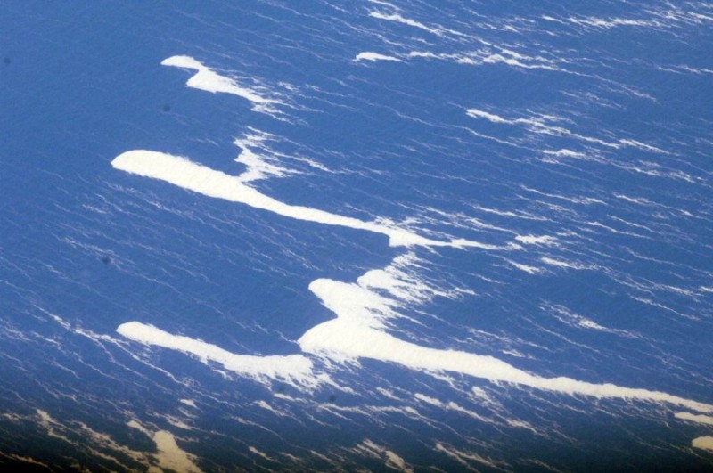 An area of floating pumice 250 nautical miles in length and 30 nautical miles wide was spotted South West of Raoul island yesterday. An RNZAF Orion on Maritime patrol from Samoa to New Zealand spotted the pumice. According to GNS science the underwater volcano Monowai has been active along the Kermadec Arc and the pumice could be a result of that activity. HMNZS CANTERBURY is on passage from Auckland to Raoul Island in the Kermadec group with a party of GNS scientists onboard. The Commanding Officer, Commander Sean Stewart changed course to intercept the pumice and bought the ship to a halt to enable retrieval of samples. The samples will be analysed to determine which volcano they came from. According to GNS scientists the activity at volcano's at Tongariro, White Island and along the Kermadec arc is unrelated.