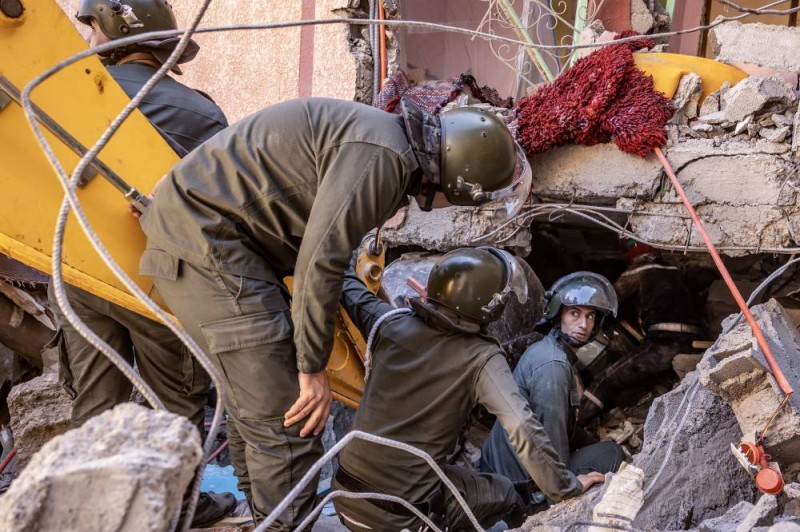 Rescue workers search for survivors in a collapsed house in Moulay Brahim, Al Haouz province, on September 9, 2023, after an earthquake. Morocco's deadliest earthquake in decades has killed at least 820 people, officials said on September 9, causing widespread damage and sending terrified residents and tourists scrambling to safety in the middle of the night. (Photo by FADEL SENNA / AFP)